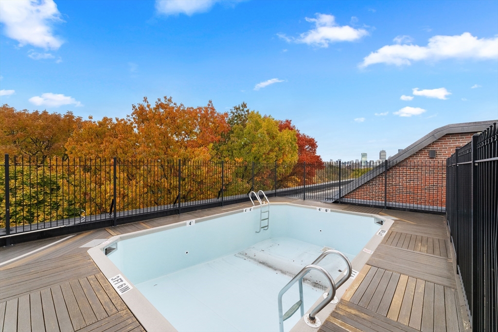 135 Pleasant Street, Unit 106 Brookline, MA 02446 - Photo 4 of 27 a view of balcony with furniture and city view