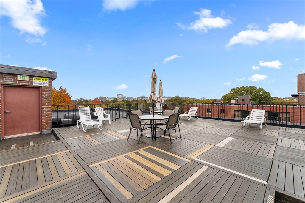 135 Pleasant Street, Unit 106 Brookline, MA 02446 - Photo 7 of 27 a view of a terrace with seating space