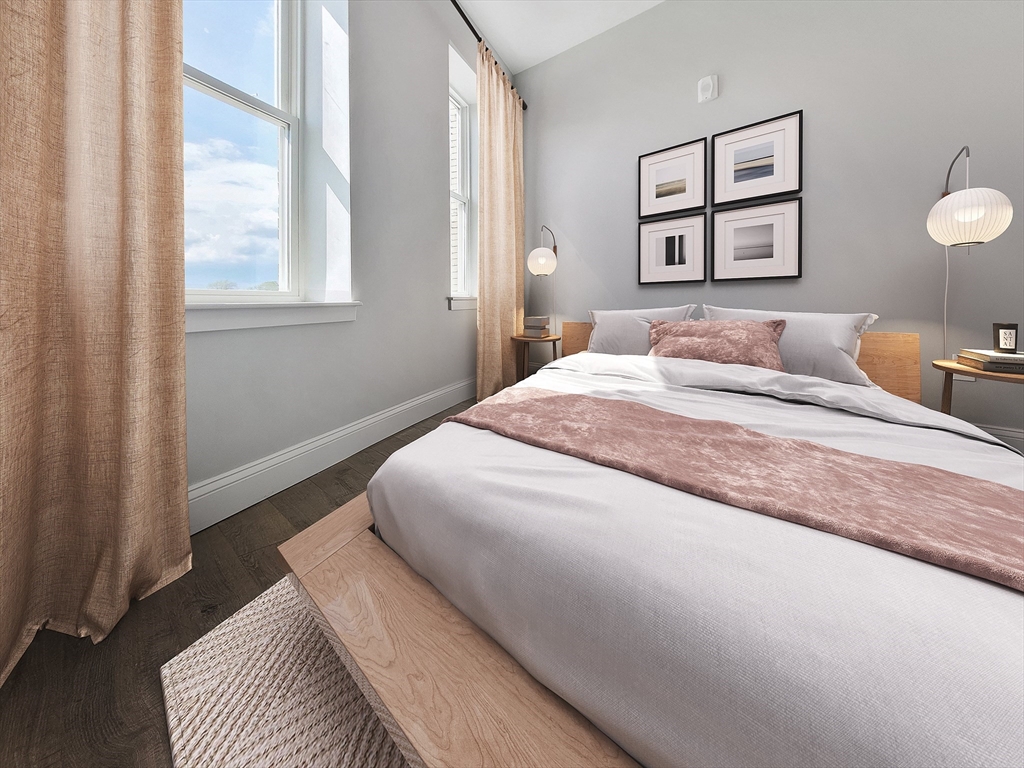 334-336 Warren Street, Unit 3 Boston, MA 02119 - Photo 5 of 10 a bedroom with bed and a window