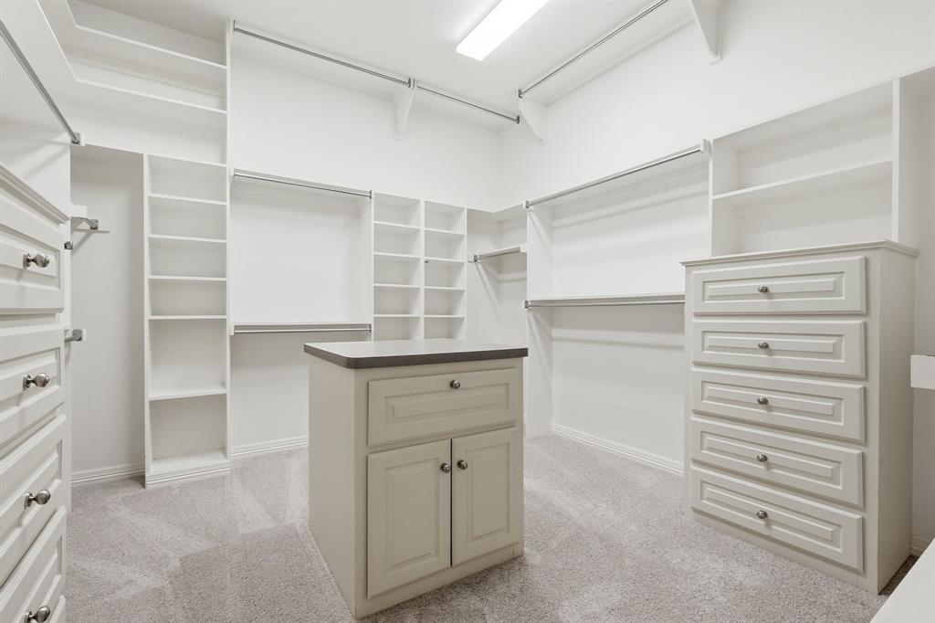 970 Crystal Cove Oak Point, TX 75068 - Photo 22 of 40 a view of walk in closet with empty racks