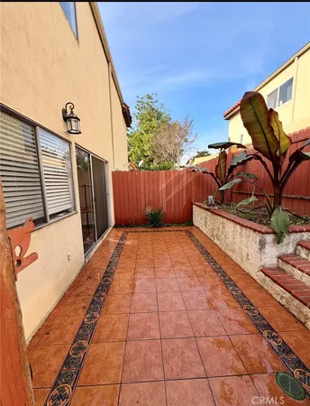 a view of a backyard with sitting area