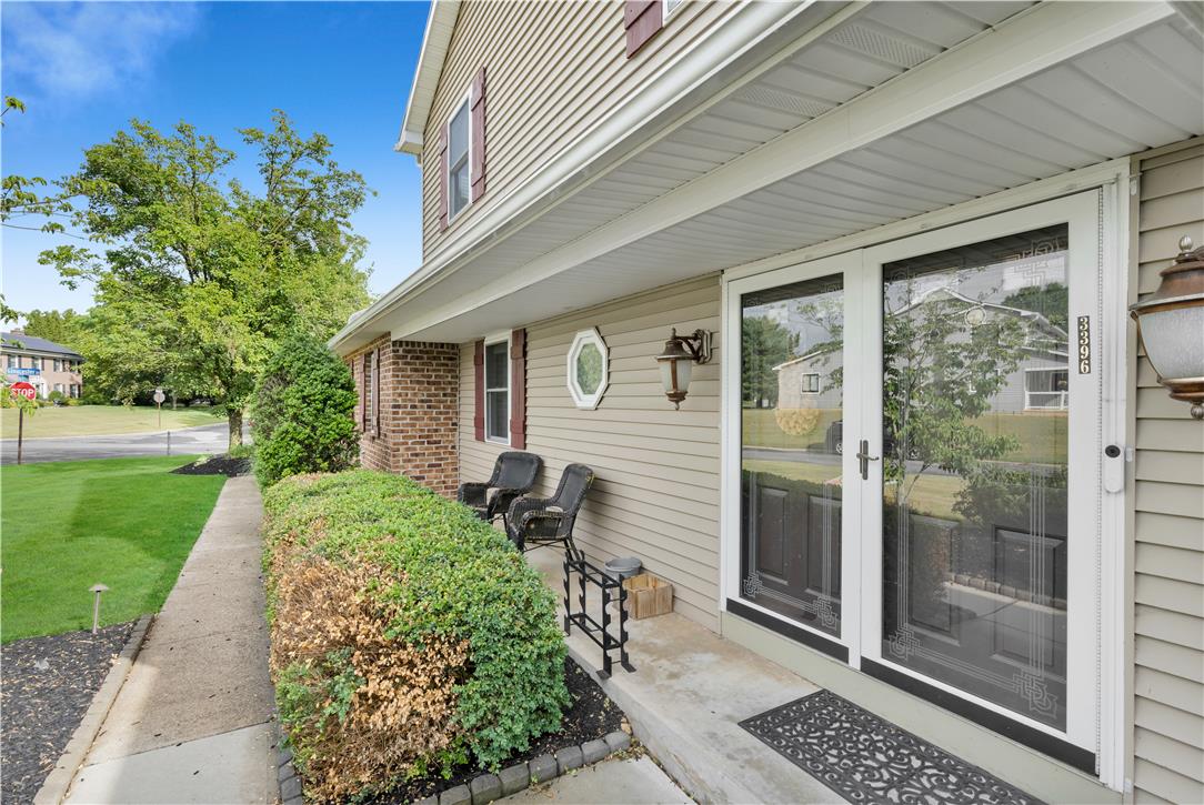 3396 Darien Road Bethlehem, PA 18020 - Photo 5 of 44 A well-maintained facade features classic siding and brickwork, welcoming guests to the home's entry.