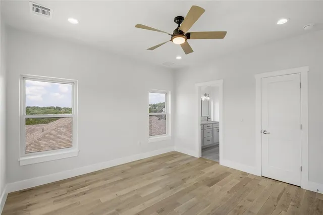 a view of a livingroom with a ceiling fan and window