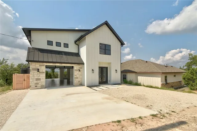 a view of a white house with a outdoor space