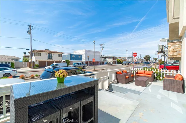 a outdoor dining space with furniture and city view