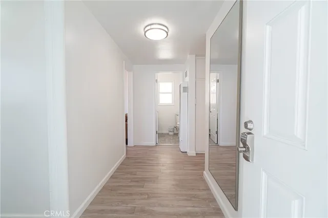 a kitchen with stainless steel appliances granite countertop white cabinets and a stove