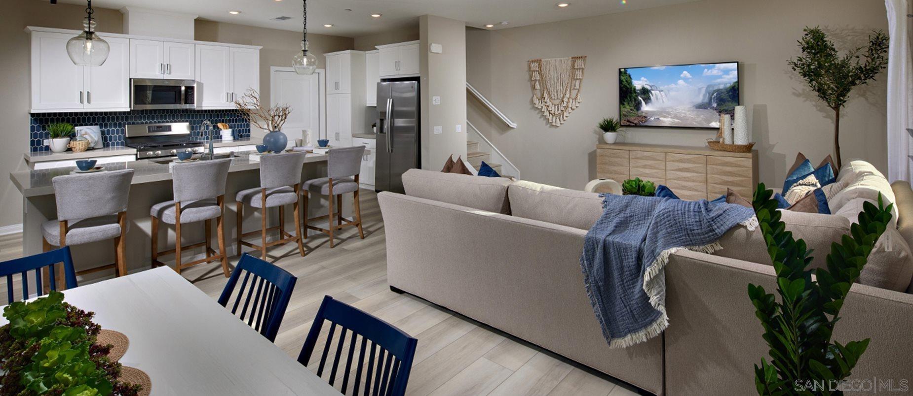 2021 Bluestone Circle, Unit HS71 PLAN Chula Vista, CA 91913 - Photo 3 of 12 a living room with furniture a flat screen tv and potted plant