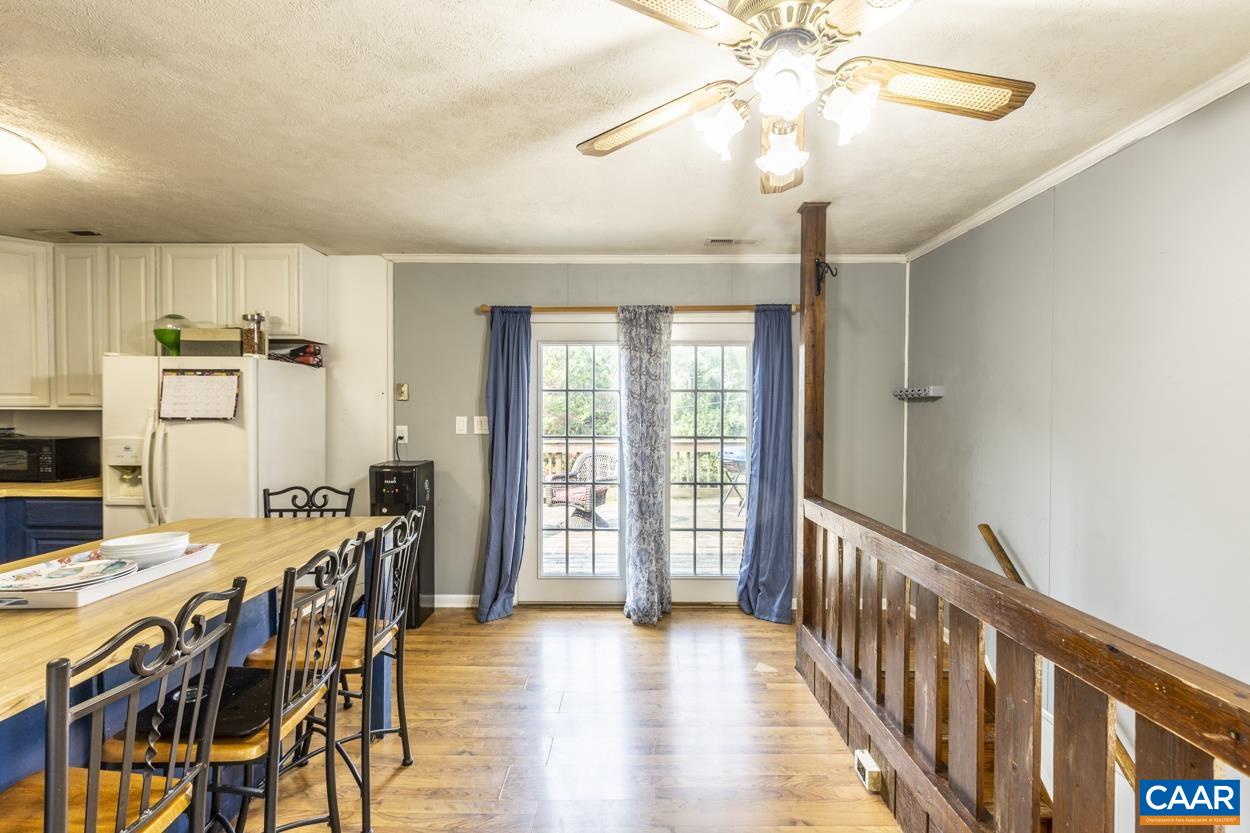 4764 Amicus Road Ruckersville, VA 22968 - Photo 1 of 33 a view of a dining room with furniture window and wooden floor