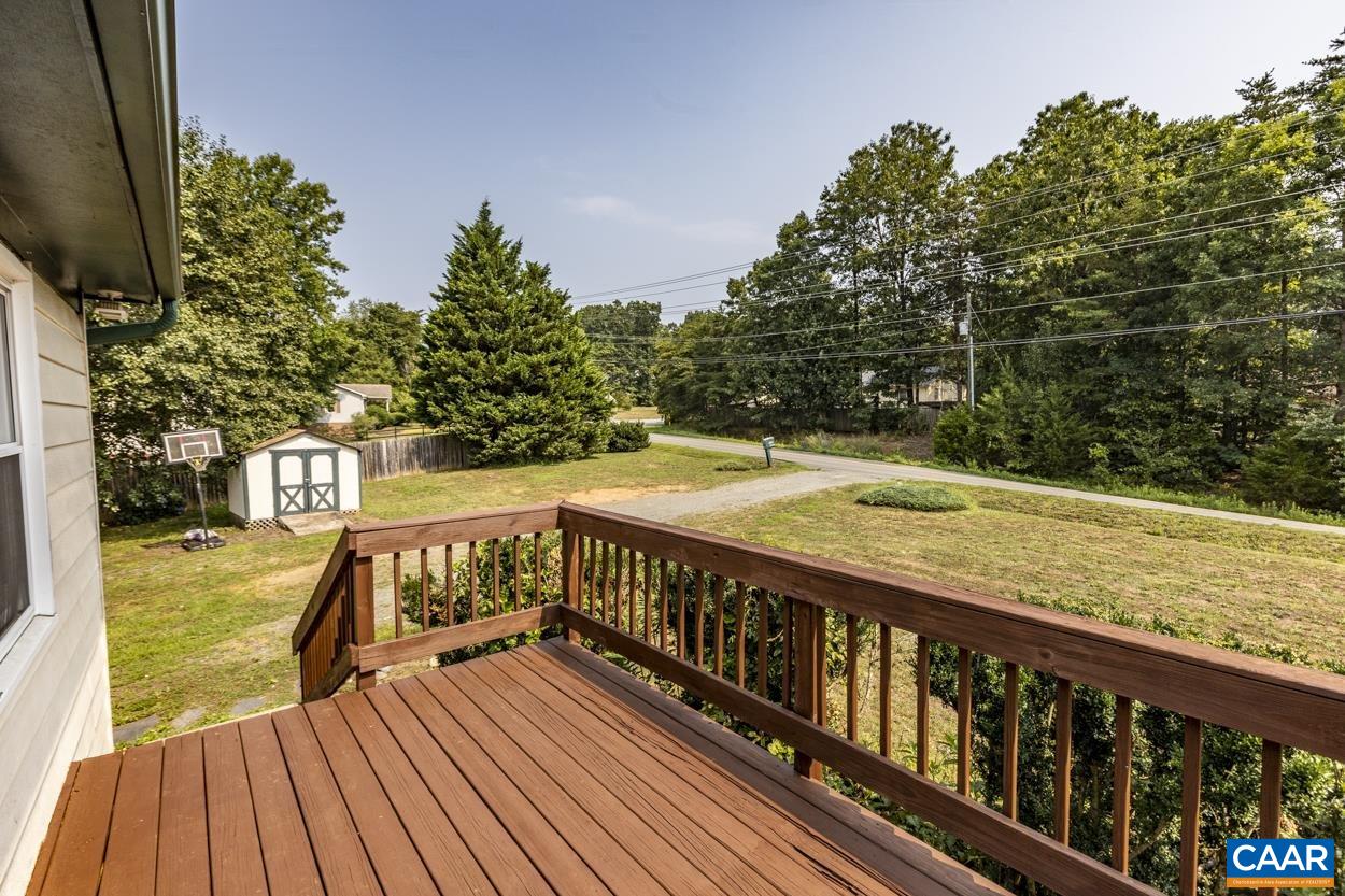 4764 Amicus Road Ruckersville, VA 22968 - Photo 13 of 33 a view of balcony with wooden floor and fence