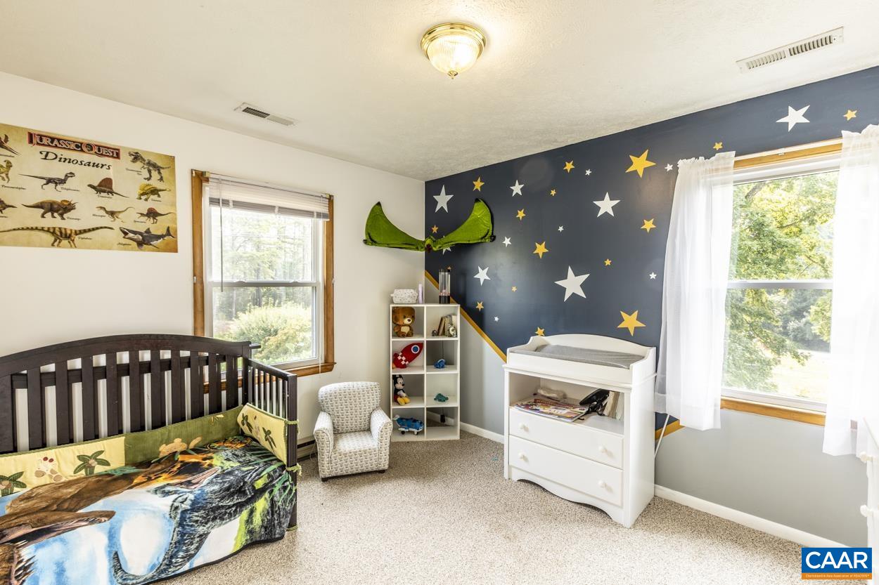 4764 Amicus Road Ruckersville, VA 22968 - Photo 23 of 33 a bedroom with furniture and a large window
