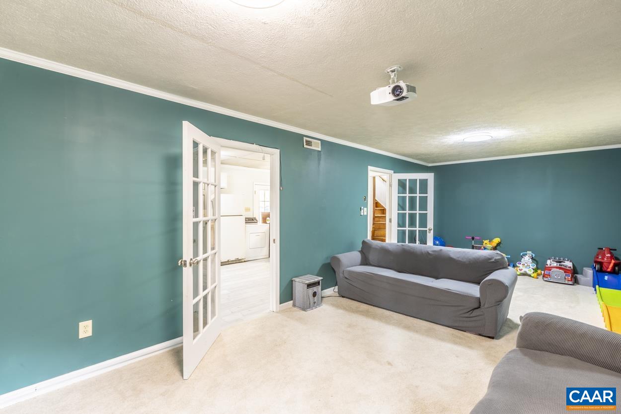 4764 Amicus Road Ruckersville, VA 22968 - Photo 25 of 33 a living room with furniture and a window