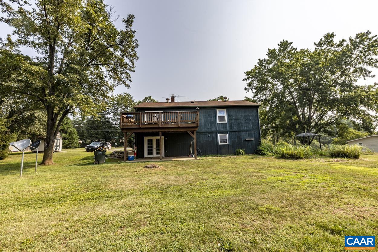 4764 Amicus Road Ruckersville, VA 22968 - Photo 7 of 33 a view of a house with a swimming pool