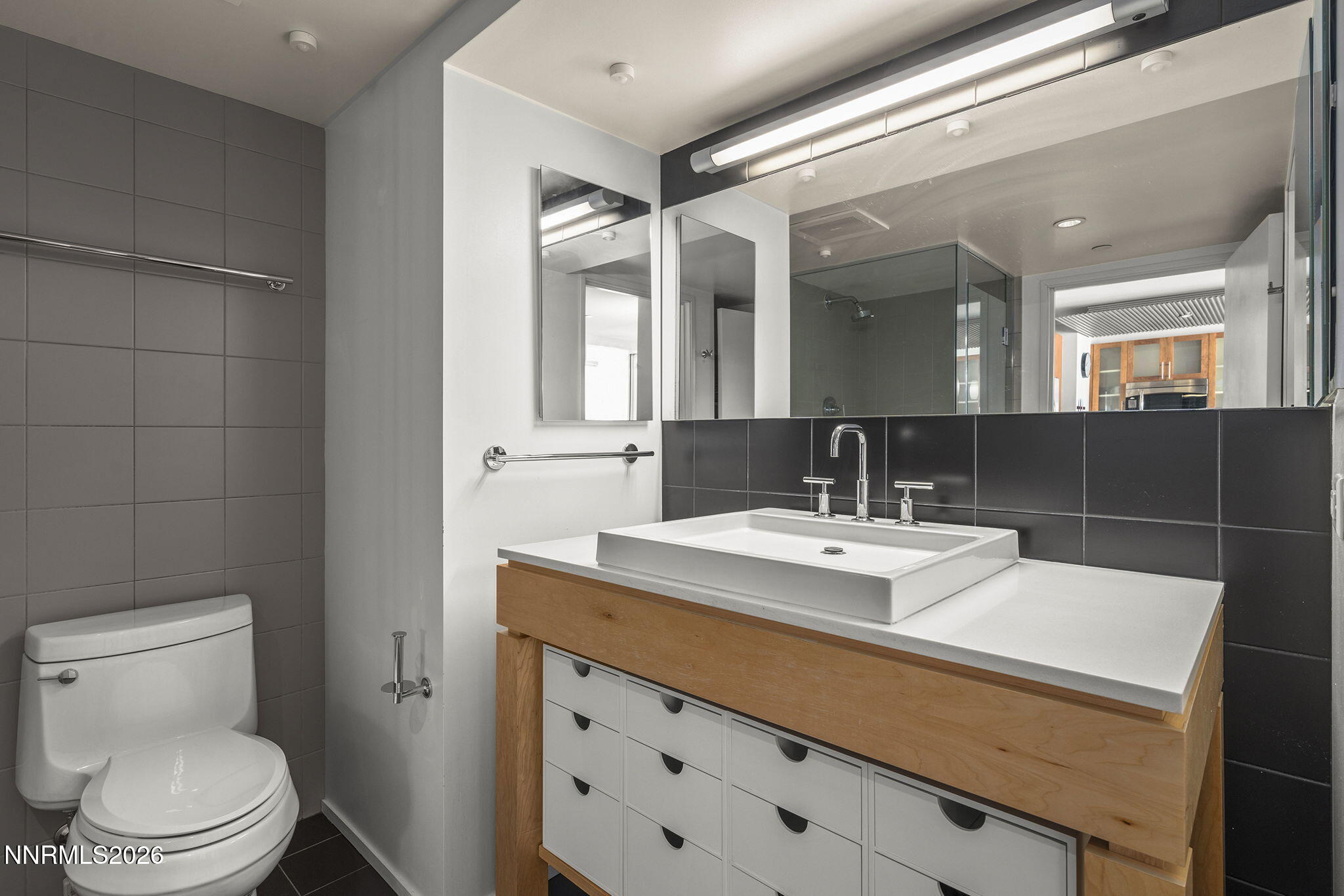 255 North Sierra Street, Unit 1408 Reno, NV 89501 - Photo 14 of 40 a bathroom with a sink toilet and mirror