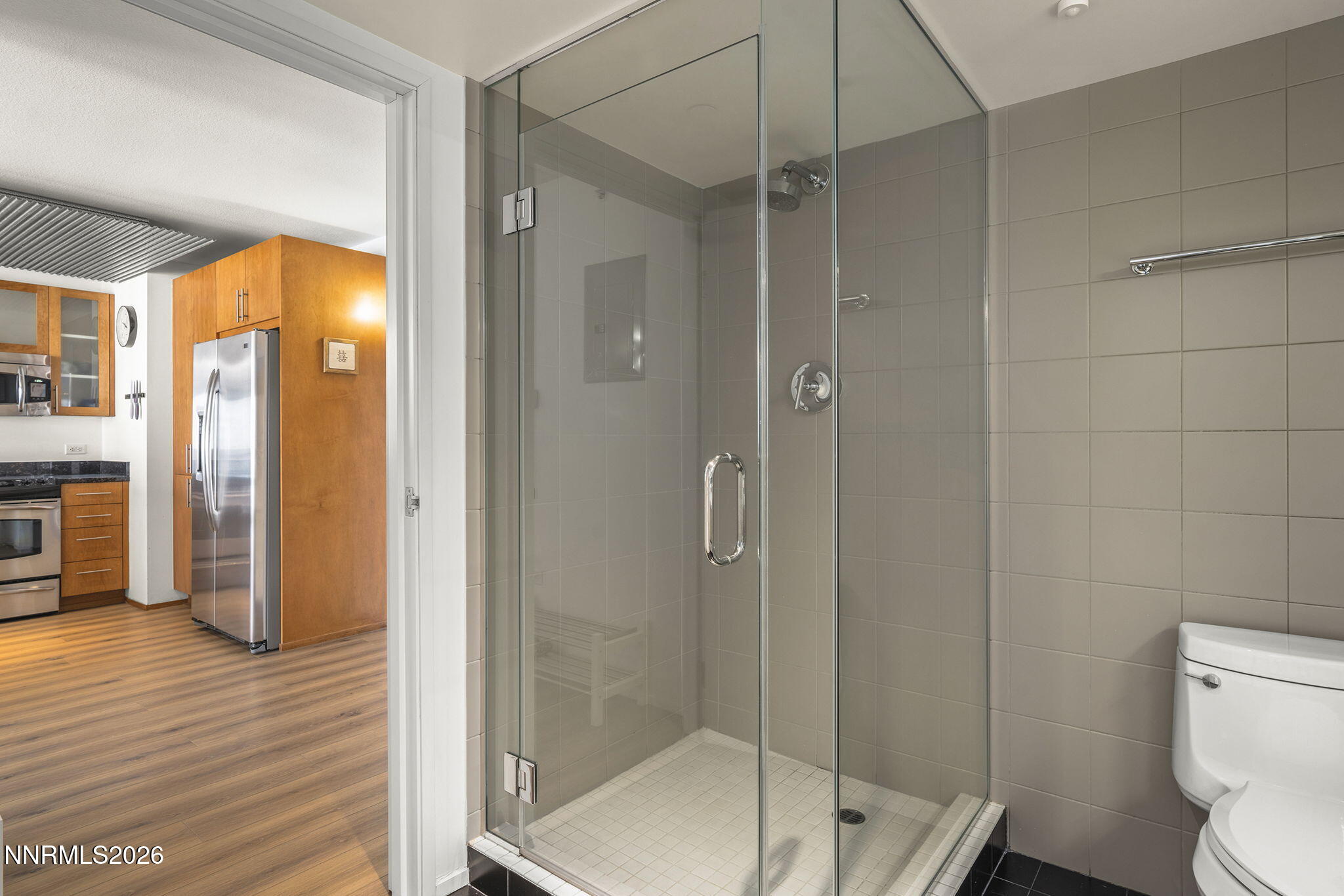 255 North Sierra Street, Unit 1408 Reno, NV 89501 - Photo 15 of 40 a bathroom with a shower and a toilet