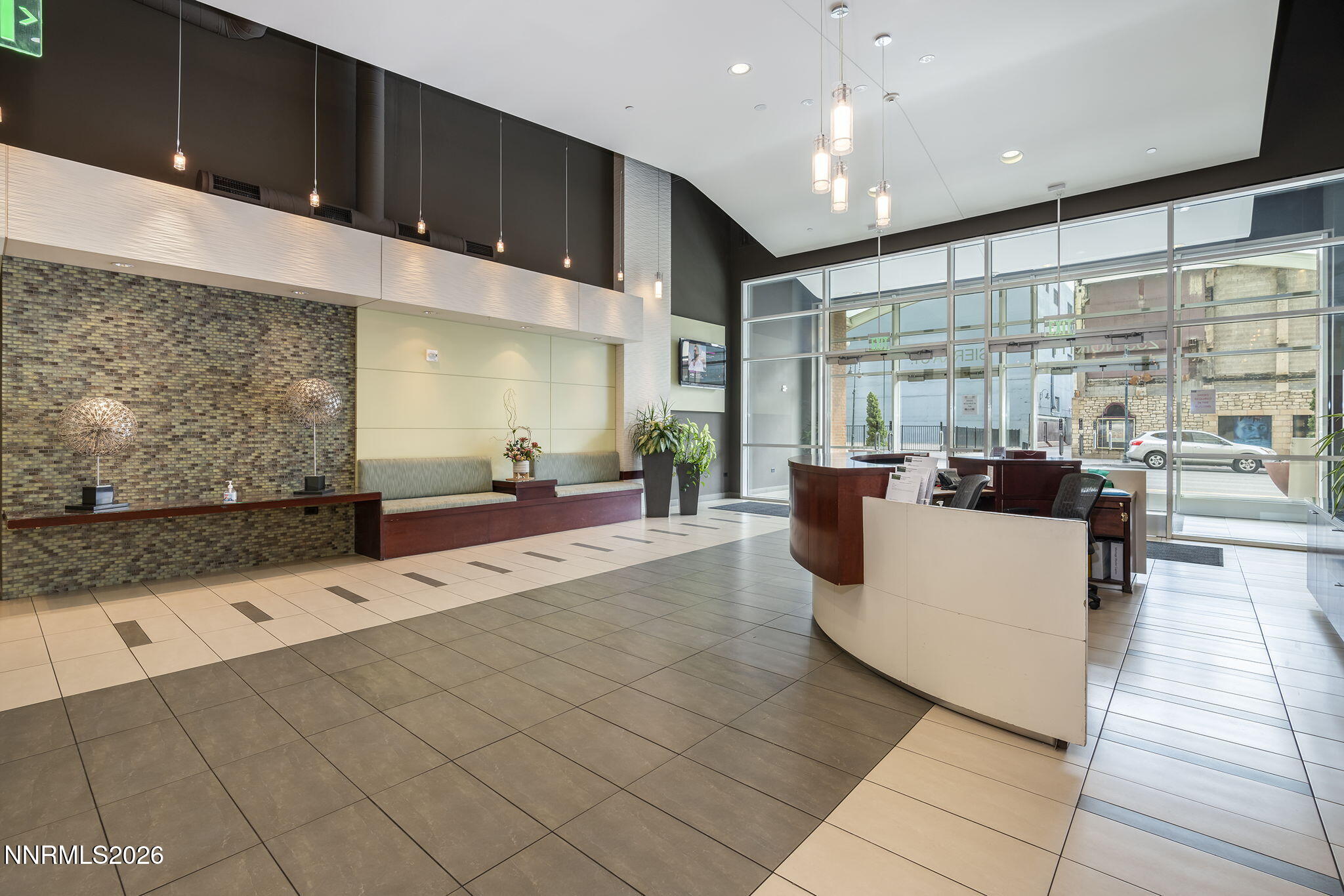 255 North Sierra Street, Unit 1408 Reno, NV 89501 - Photo 22 of 40 a living room with stainless steel appliances kitchen island granite countertop a sink and cabinets