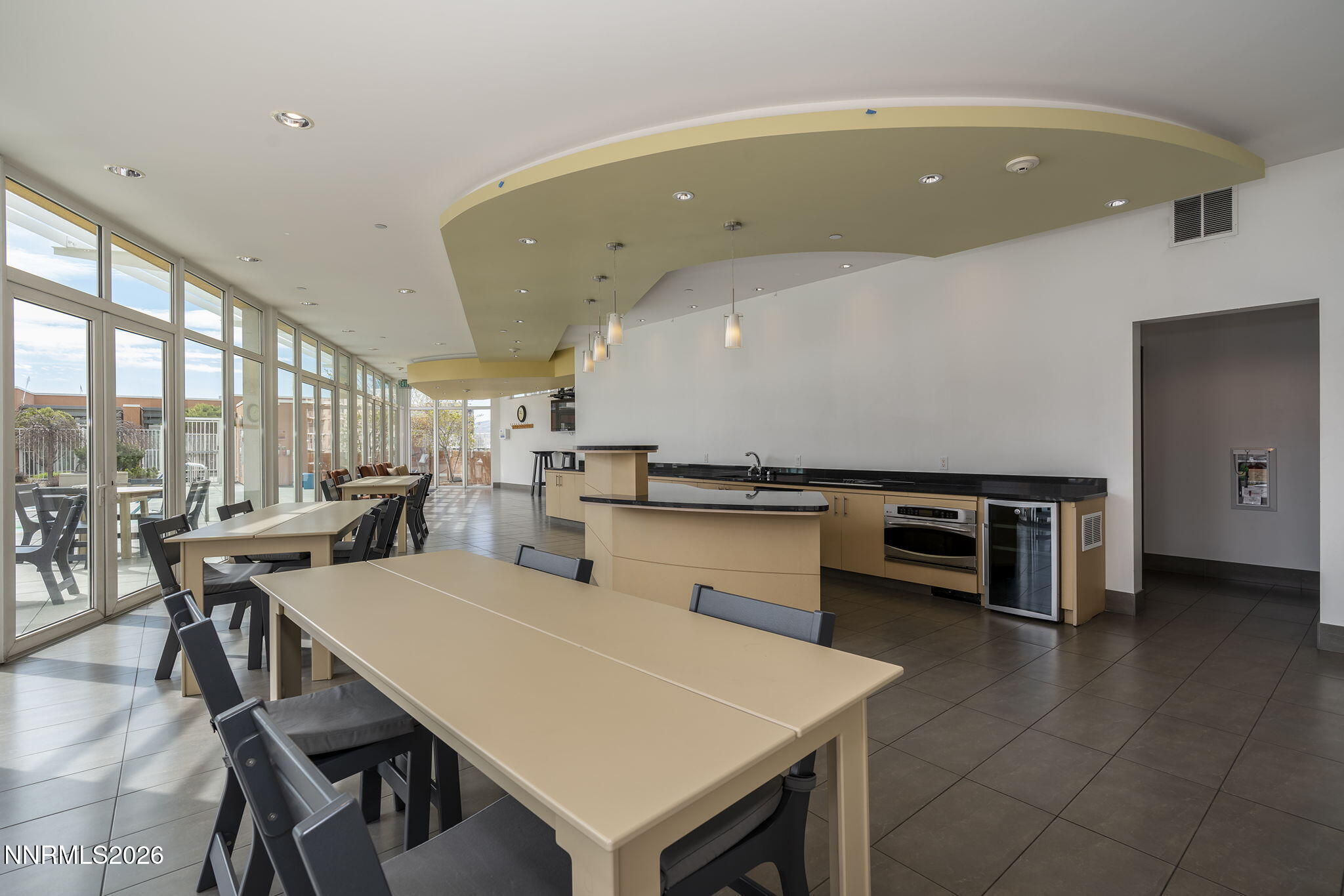 255 North Sierra Street, Unit 1408 Reno, NV 89501 - Photo 30 of 40 a open kitchen with a table and chairs