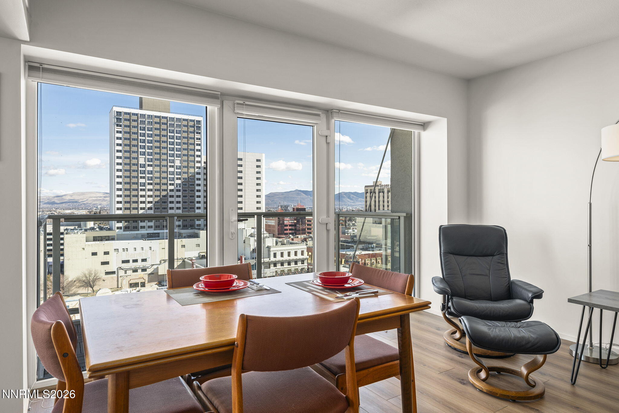 255 North Sierra Street, Unit 1408 Reno, NV 89501 - Photo 6 of 40 a living room with furniture and a floor to ceiling window