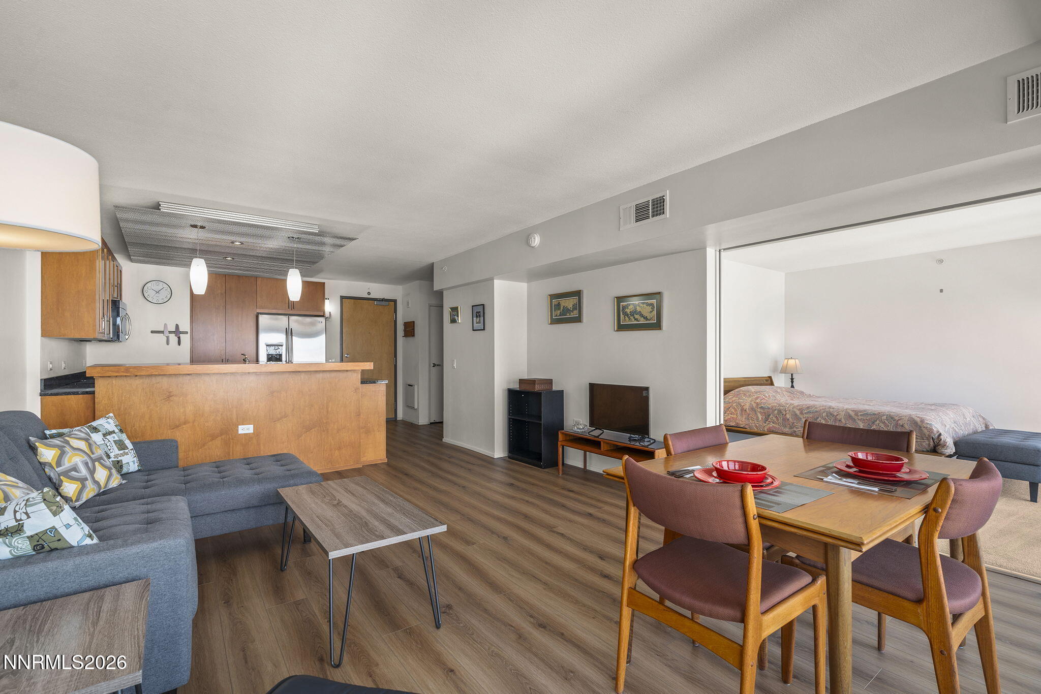 255 North Sierra Street, Unit 1408 Reno, NV 89501 - Photo 8 of 40 a living room with furniture and a wooden floor
