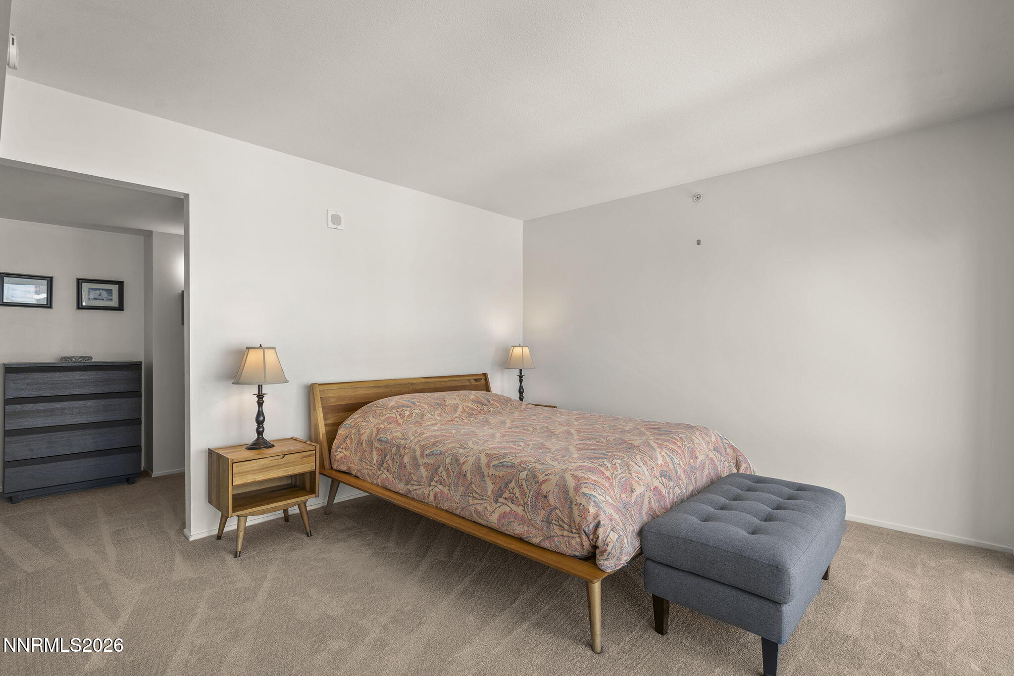 255 North Sierra Street, Unit 1408 Reno, NV 89501 - Photo 9 of 40 a bedroom with a bed and a lamp