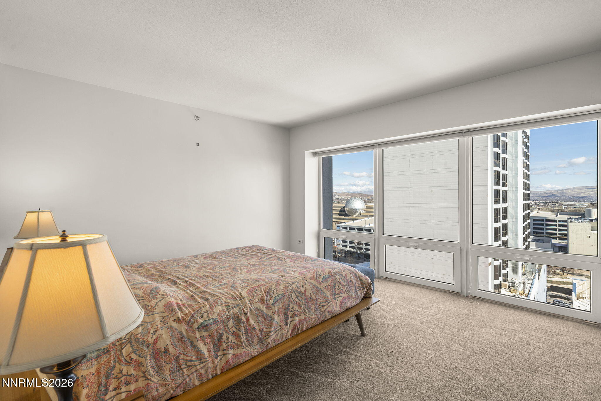 255 North Sierra Street, Unit 1408 Reno, NV 89501 - Photo 10 of 40 a bedroom with a bed and a large window