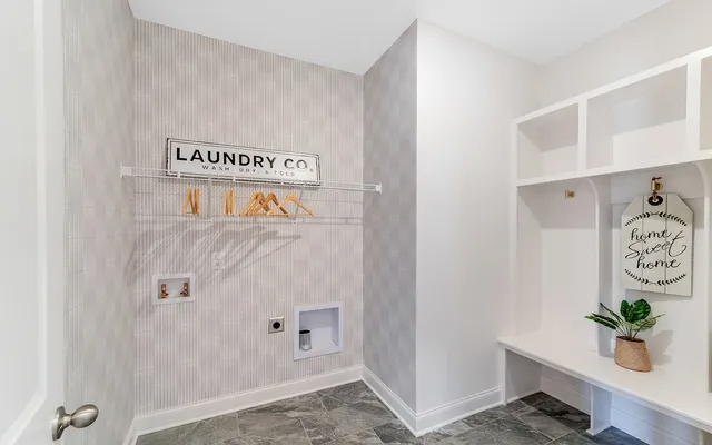 a view of front door with wooden floor