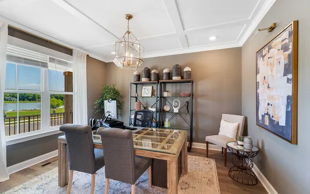 a view of a livingroom with furniture window and wooden floor
