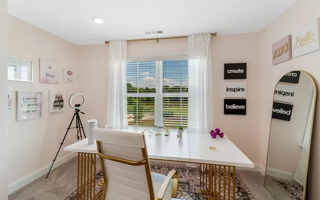 a room that has a bed and a table in it