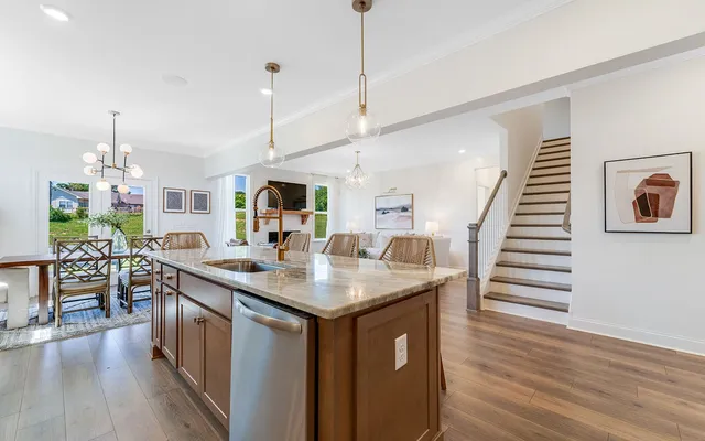 a kitchen with sink and center island