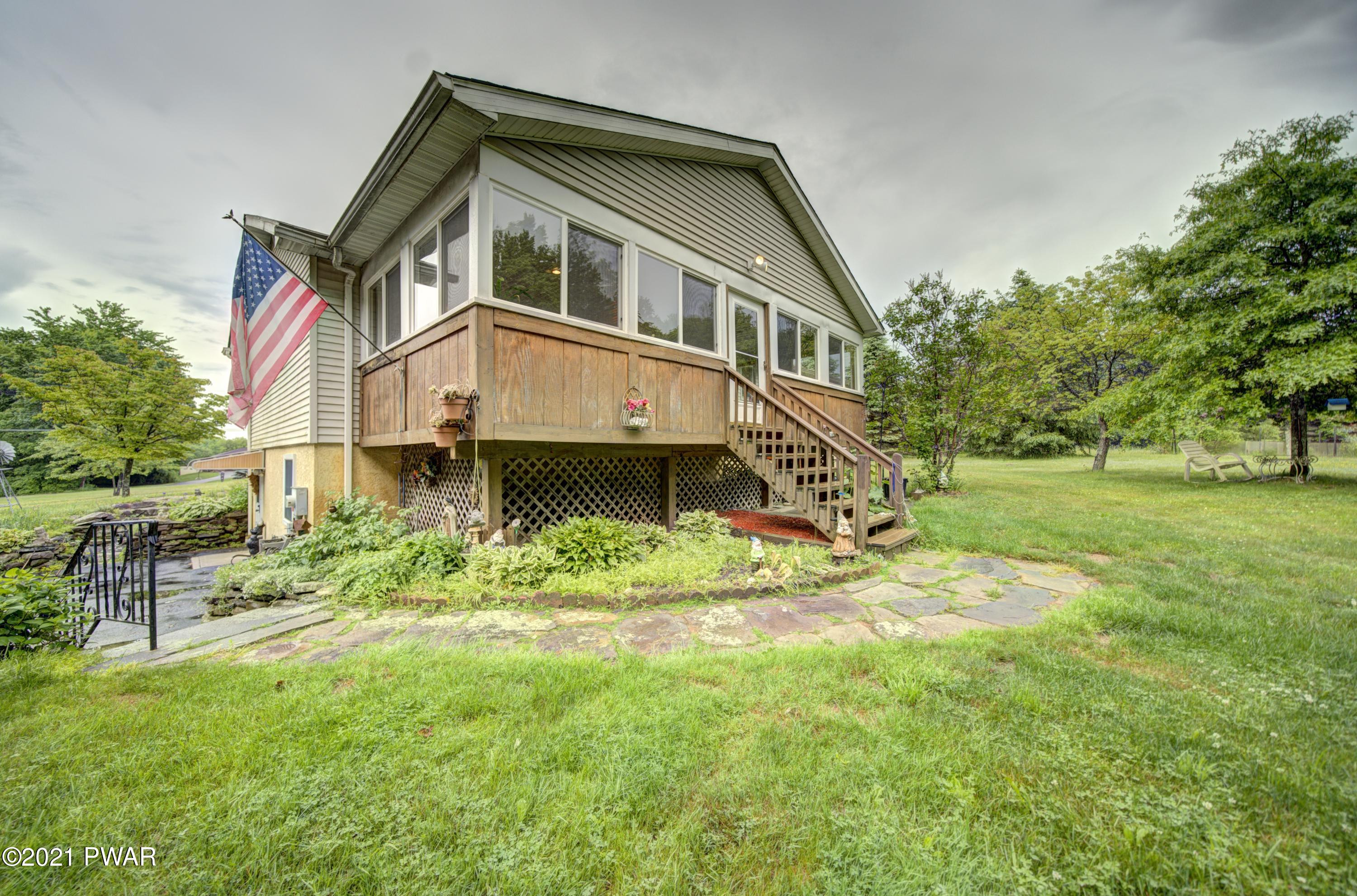 368 Roemerville Road Greentown, PA 18426 - Photo 57 of 59 a front view of a house with a yard