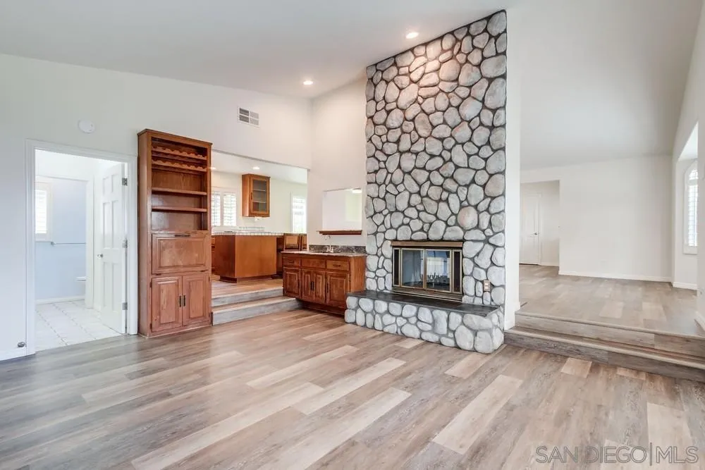 227 Hutchison Street Vista, CA 92084 - Photo 21 of 58 a living room with furniture and a fireplace