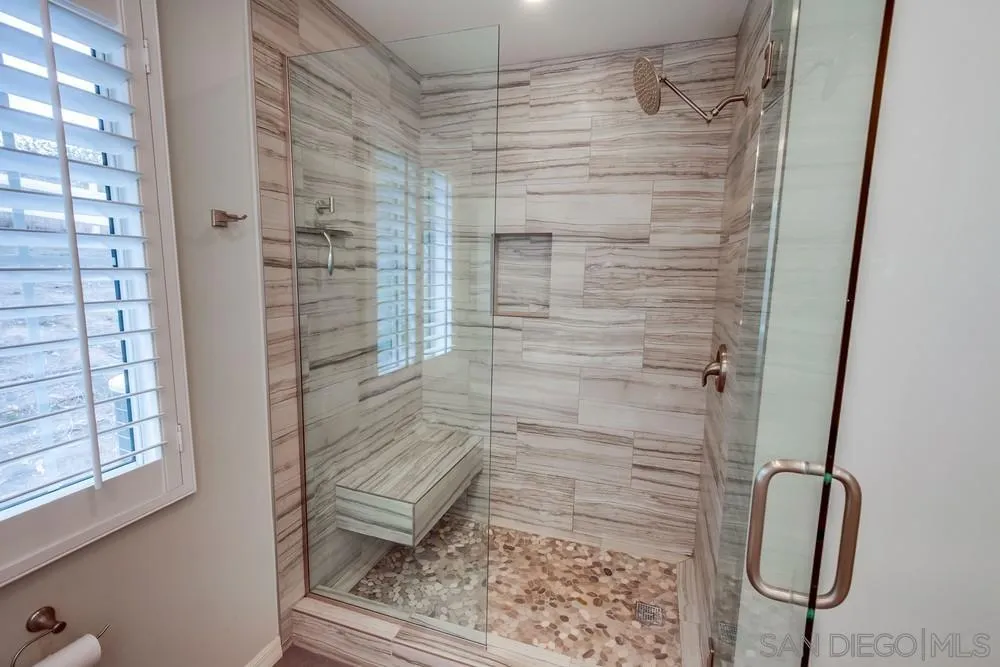 227 Hutchison Street Vista, CA 92084 - Photo 28 of 58 a bathroom with a shower
