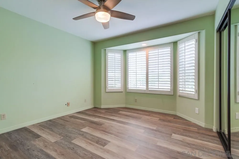 227 Hutchison Street Vista, CA 92084 - Photo 29 of 58 a view of empty room with window and ceiling fan