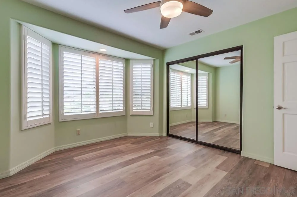 227 Hutchison Street Vista, CA 92084 - Photo 30 of 58 a view of room with window and hardwood