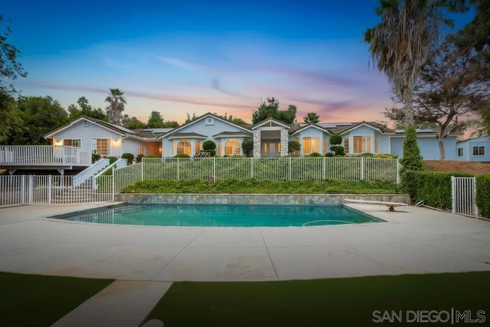 227 Hutchison Street Vista, CA 92084 - Photo 3 of 58 a front view of a house with a garden and yard