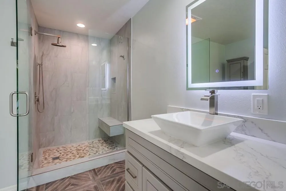 227 Hutchison Street Vista, CA 92084 - Photo 36 of 58 a bathroom with a sink and a mirror