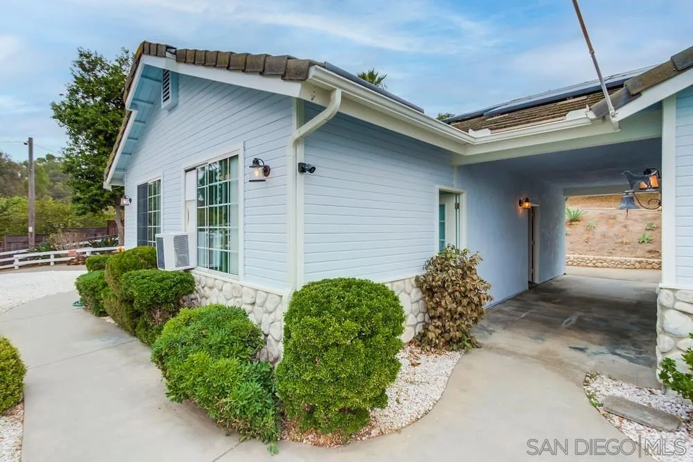 227 Hutchison Street Vista, CA 92084 - Photo 45 of 58 a front view of a house with garden