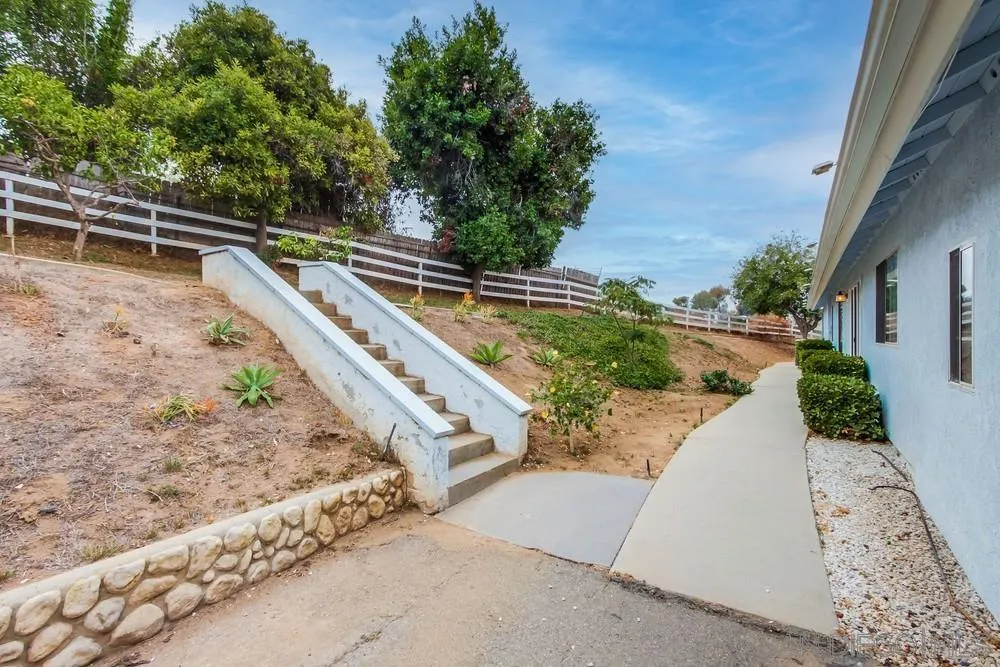 227 Hutchison Street Vista, CA 92084 - Photo 47 of 58 a view of a yard with a wooden fence