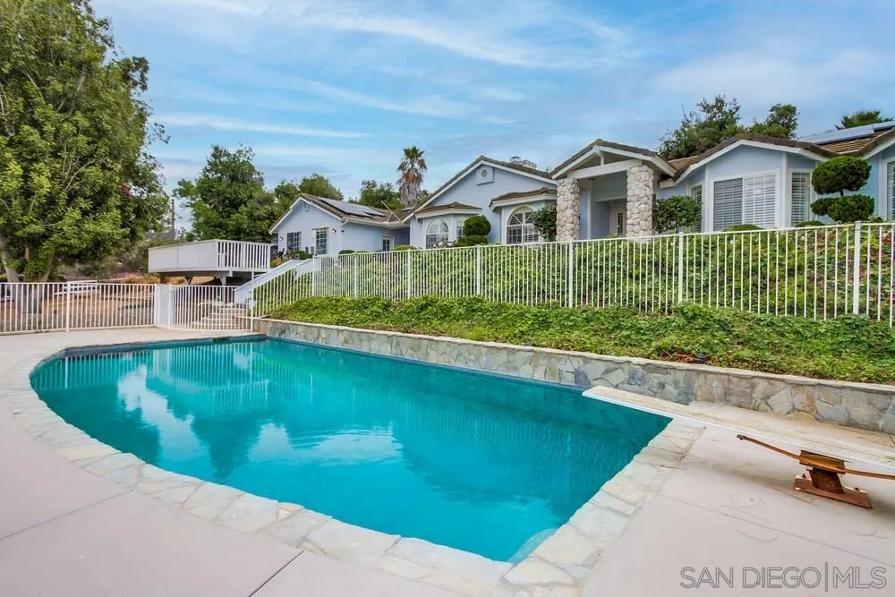 227 Hutchison Street Vista, CA 92084 - Photo 52 of 58 a view of a house with pool plants and large trees