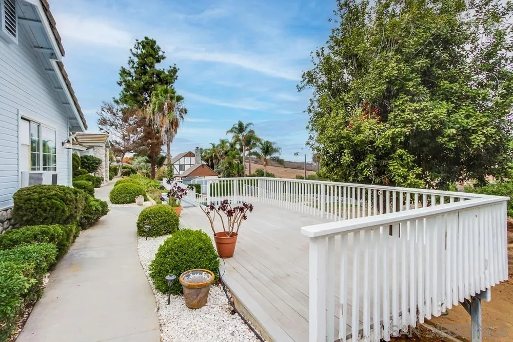 227 Hutchison Street Vista, CA 92084 - Photo 6 of 58 a view of a two chair in the patio with potted plants