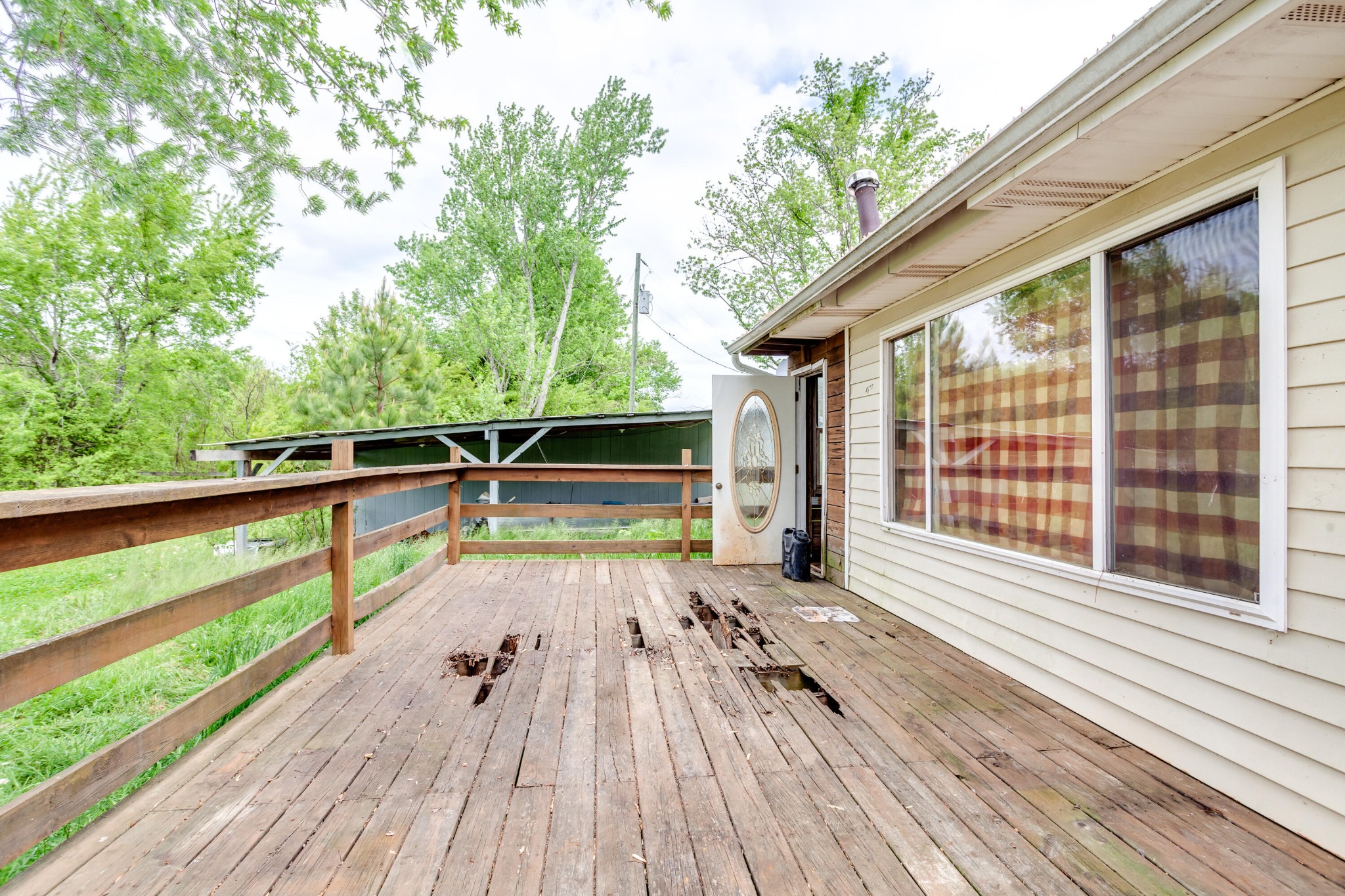 3045 Oakland Road Philadelphia, TN 37846 - Photo 29 of 37 a view of outdoor space with wooden floor and deck