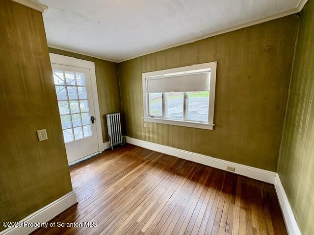 706 Delaware Street Forest City, PA 18421 - Photo 18 of 33 a view of an empty room with wooden floor and a window