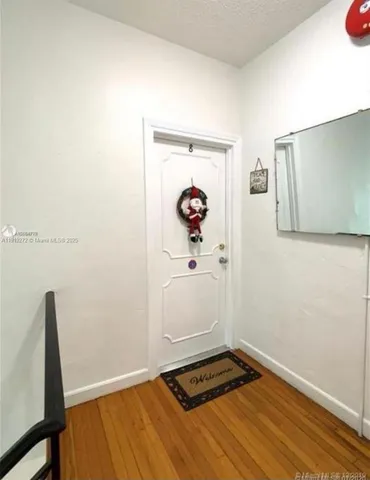 a hallway with wooden floor