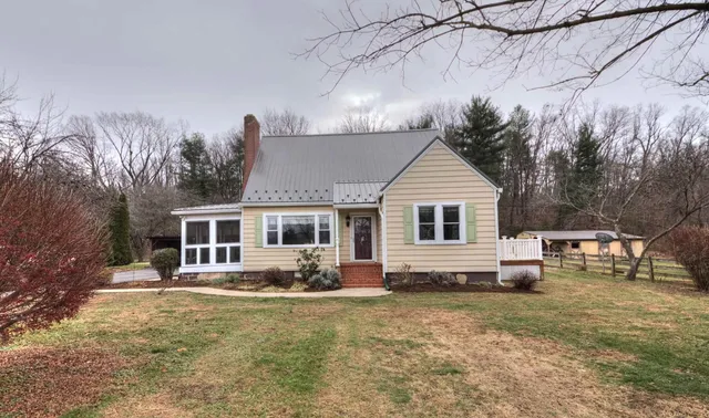 a front view of a house with yard