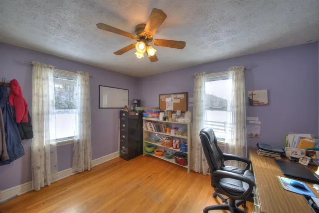 a bathroom with a sink and mirror with window