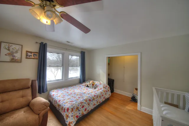 a bedroom with furniture and a window