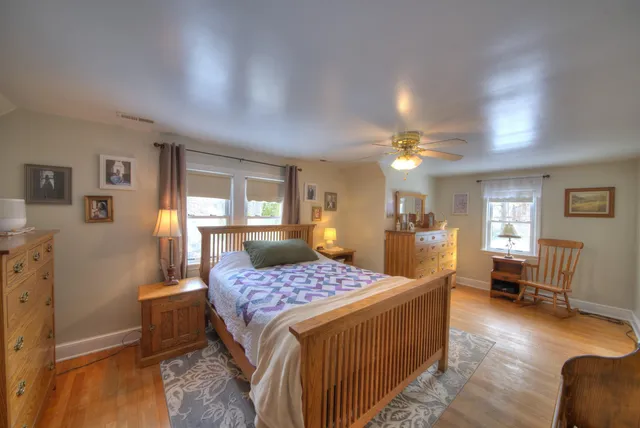 a bed room with furniture and a window