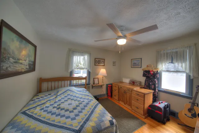 a bathroom with a sink toilet and a mirror