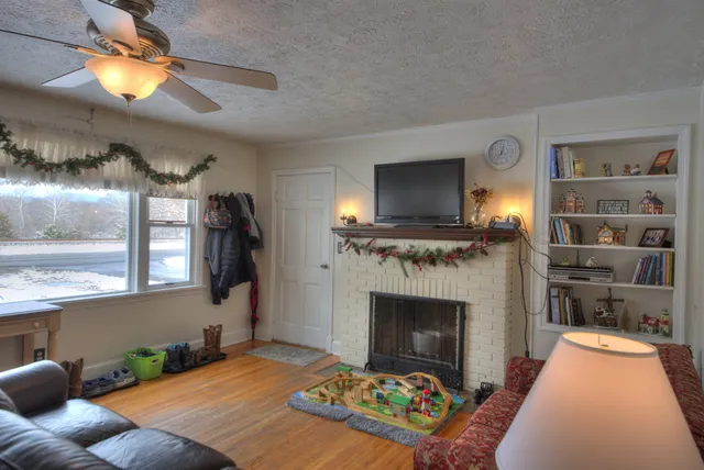 a bedroom with furniture and a window
