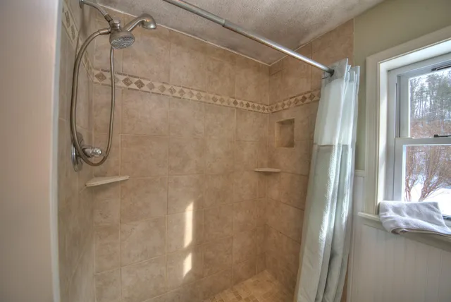 a view of a livingroom with furniture and windows