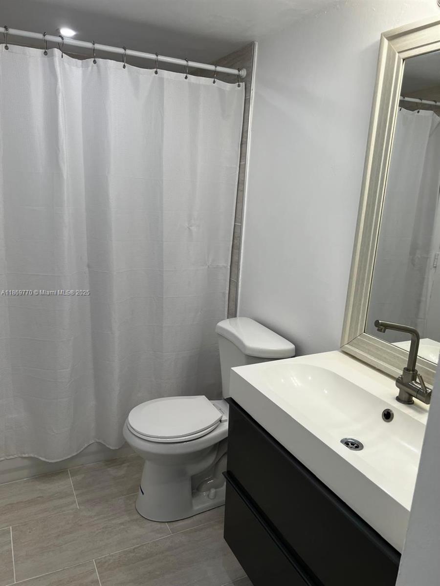 4164 Inverrary Drive, Unit 510 Lauderhill, FL 33319 - Photo 15 of 21 a bathroom with a sink and a toilet